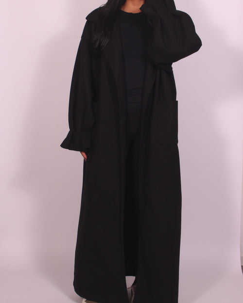 Elegant lång svart klänning med avslappnad silhuett – enkel stil för varje dag